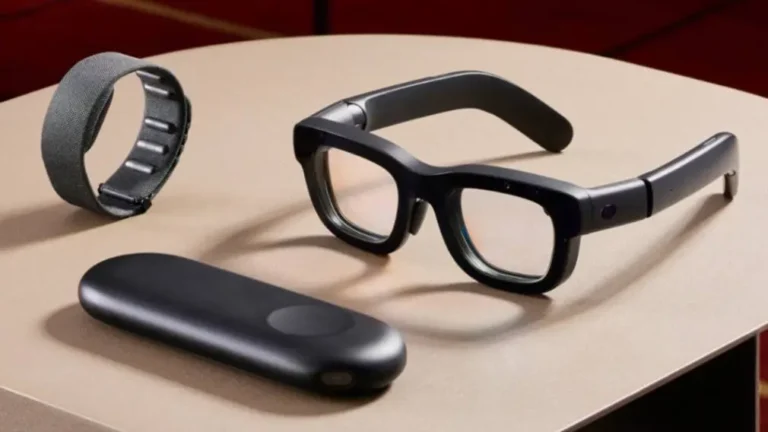 a pair of glasses and a microphone on a table - meta-orion-ar-glasses-vskel