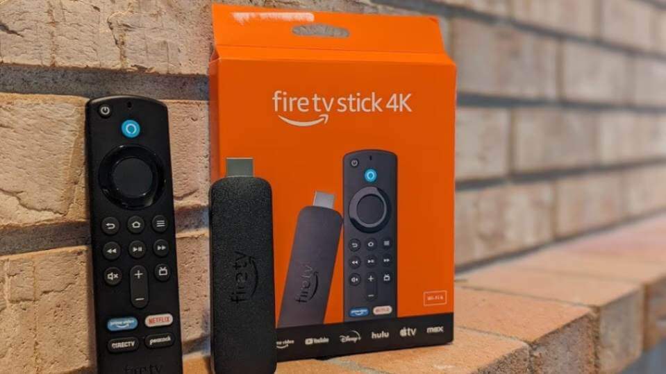 amzon firestick with remote and its box near to a wall - How to Connect Meta Quest 3 or 3S to Samsung TV - vskel